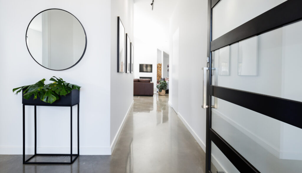 Contemporary home entry with polished concrete floors
